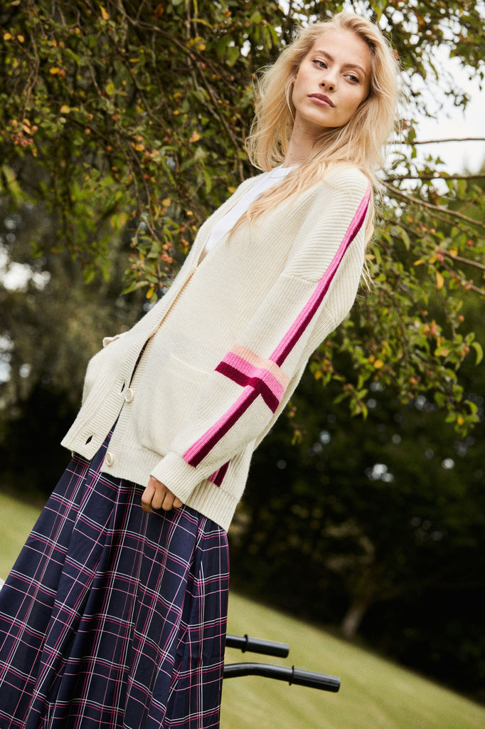 Daffodil Cardigan in Apres Ski Club - Relaxed fit ivory cardigan with contrast pink & red stripes on the sleeves