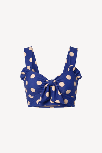 Blue bikini top with white polka dots on a white background