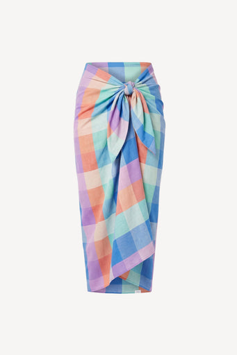 A sarong with a large twisted knot at the waist, featuring a pastel multicolor gingham check pattern in blue, pink, orange, and purple on a light background.