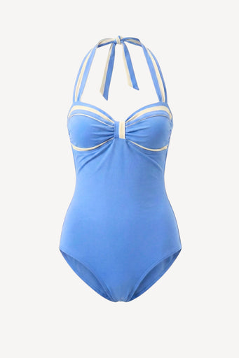 Blue swimsuit with white accents on a light gray background