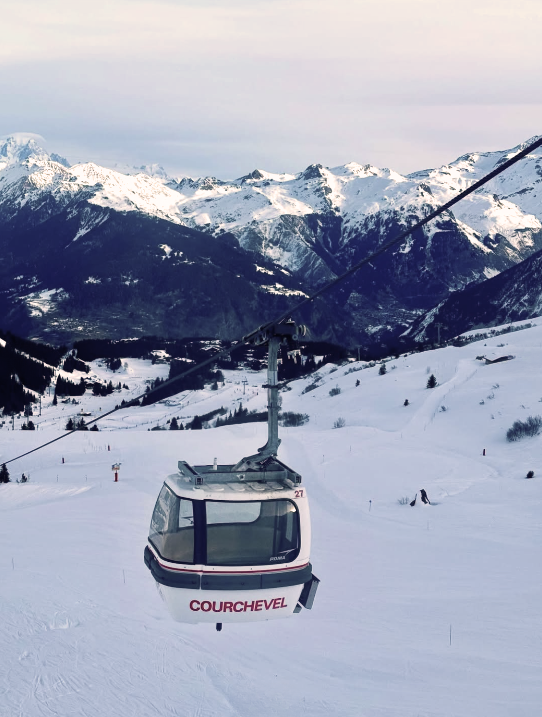 Ski lift in Courchevel against a snow covered mountain